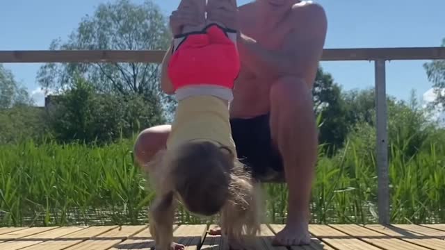 .Father And Daughter Perform Various Exercises Together And Go For a Swim After