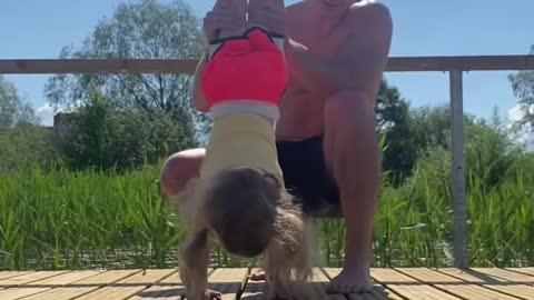.Father And Daughter Perform Various Exercises Together And Go For a Swim After
