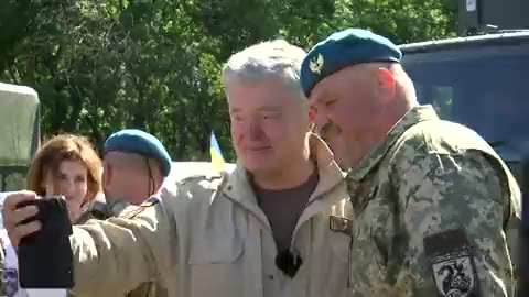 Former Ukrainian President with black Nazi symbol 0:55