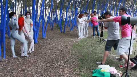 blue trees and naked painted girls