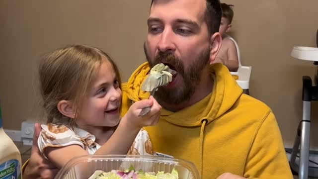 Daughter Feeds Dad Aggressively