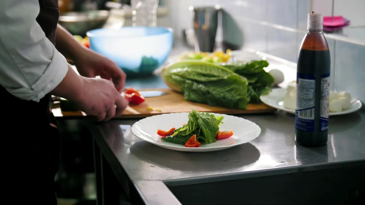 Chef preparing salad in the restaurant kitchen