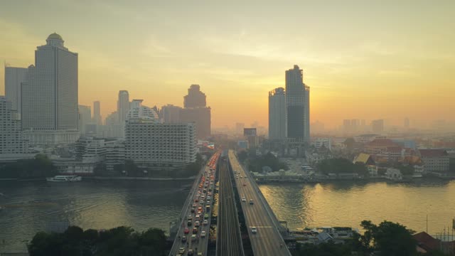 drone shot flying along Taksin Bridg