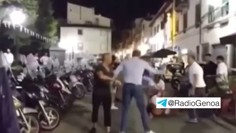 A Moroccan throws stone and is beaten up by Italian customers