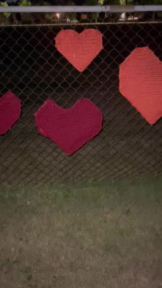 Hearts woven in a school fence