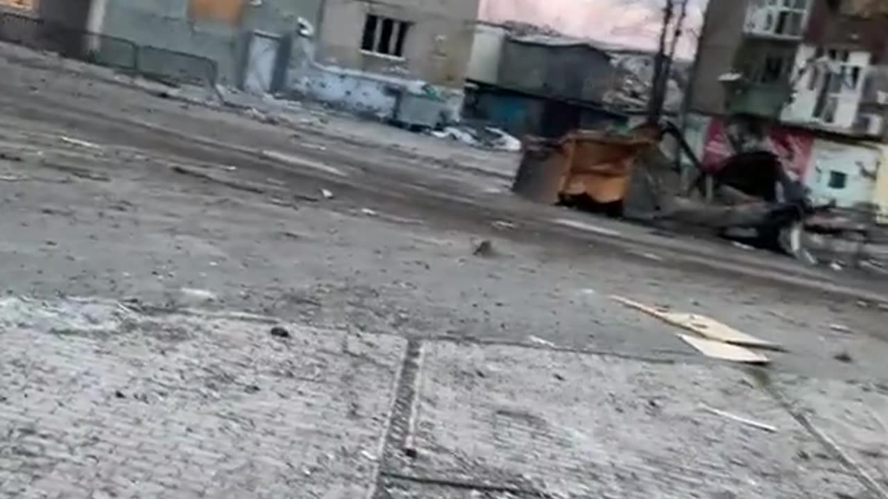 Ukrainian soldiers running from gunfire in Bahmut