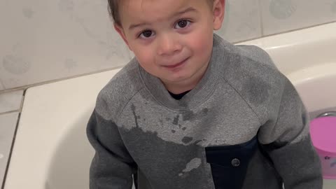 Toddler Climbs into Bathwater Fully Clothed