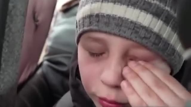 Heartbreaking moment boy says he left his father in Kyiv