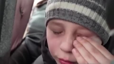 Heartbreaking moment boy says he left his father in Kyiv