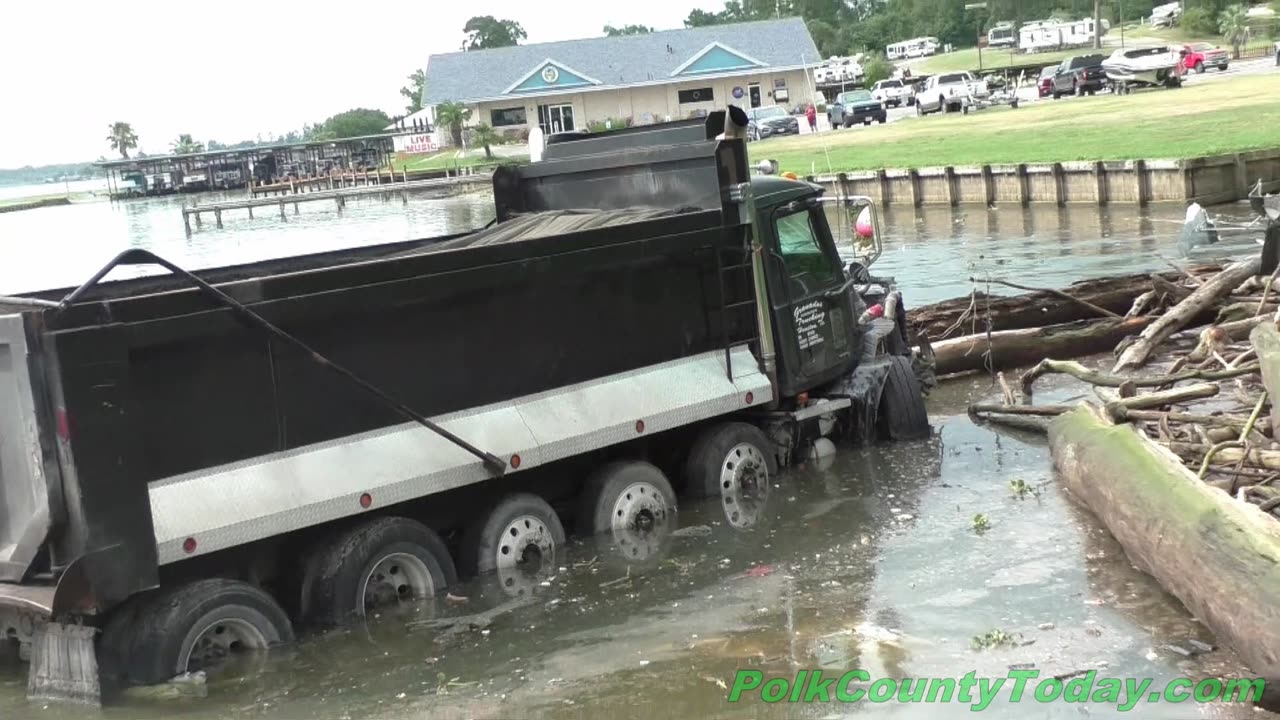 DUMP TRUCK CRASHES INTO LAKE LIVINGSTON, ONALASKA TEXAS, 07/01/24...