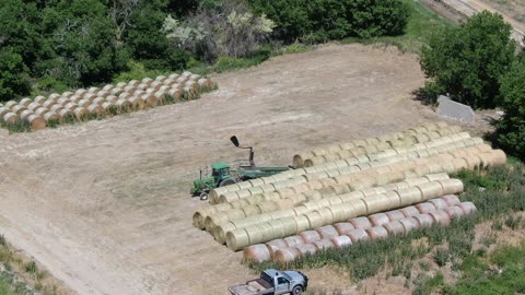 Zoom in on Chance delivering bales