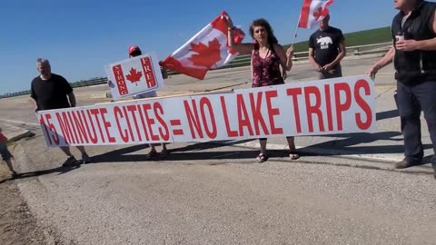 15 Minute Cities Banner Hanging at Birds Hill Overpass