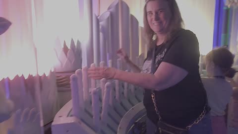 Playing the organ at Meow Wolf