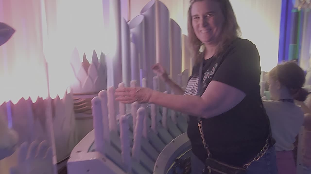 Playing the organ at Meow Wolf