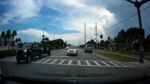 Completely clueless driver pulls into oncoming traffic