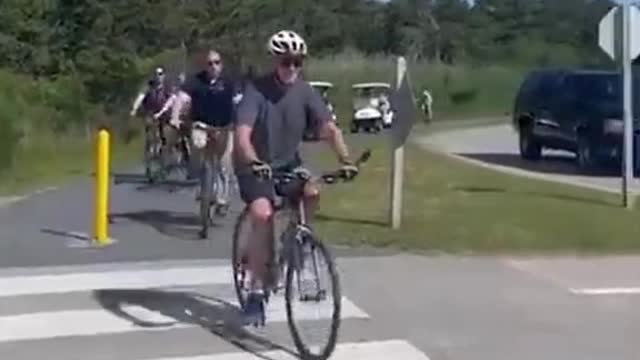 Biden falls off his bike after trying to dismount!