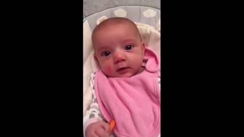 The 8-week-old baby says to the mother, "I love you."