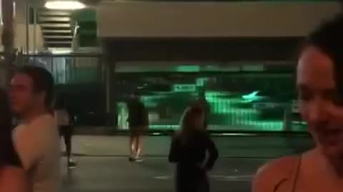 Guy black shirt catches cigarette in mouth