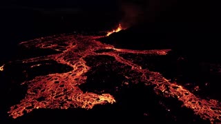 Lava flowing from the craters in Merardalir eruption Iceland