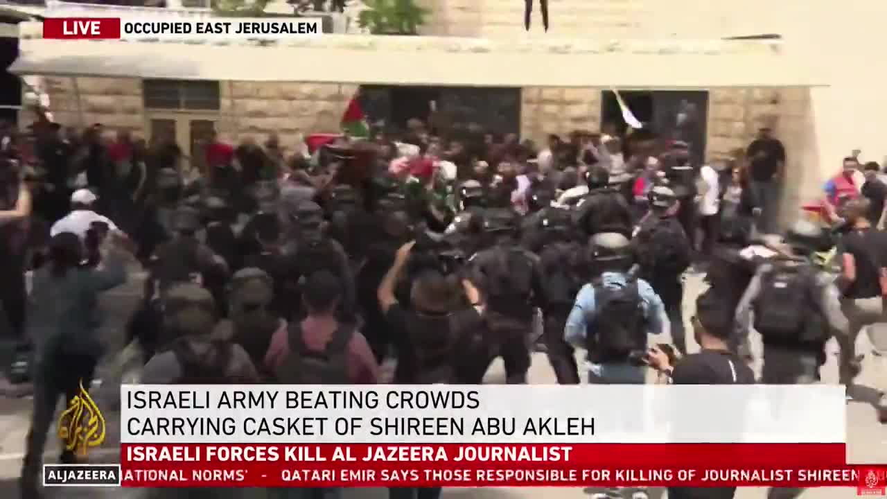 Israeli Police attack the Palestinians carrying the casket of Israeli-murdered Al Jazeera journalist