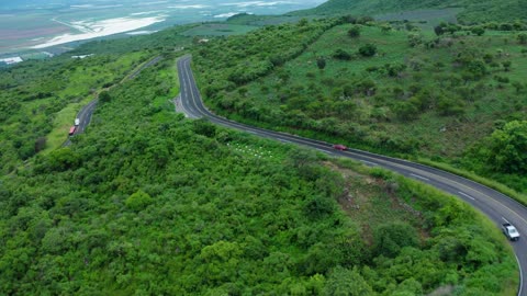 Curvy road on a tree covered hill