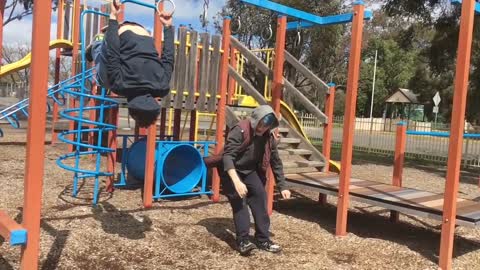 Blue hair playground backflip hits head