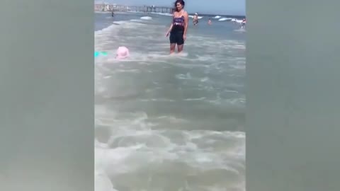 CHILDREN HAVING FUN ON THE BEACH