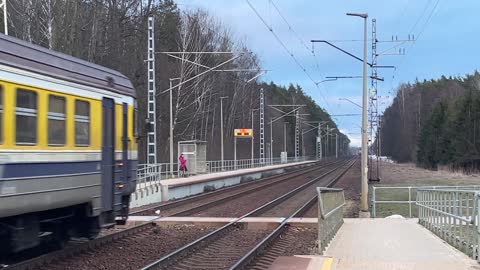 Wide Angle Shot of a Train Passing By the Rail Road