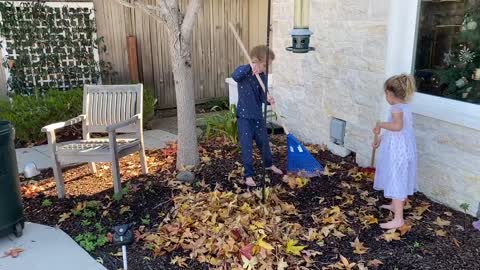 Girls Raking Leaves