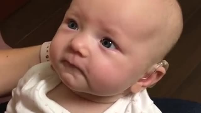 My baby hears me for the first time and is almost moved to tears!