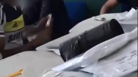 Surveillance Video: Britain's Covid Testing Facility Shows Tests being thrown out by the thousands