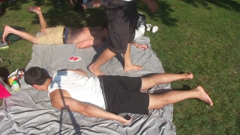 Luodong Massages White Man In White Shirt At The Park
