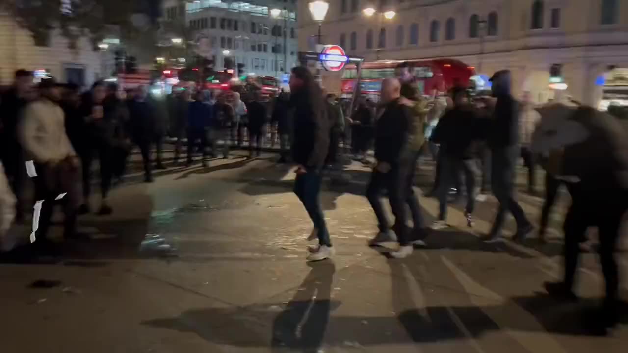 Anti-Israel protesters and British football fans clashed at Trafalgar Square in London last night