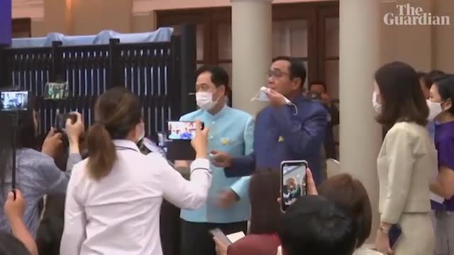 Thai PM sprays disinfectant on journalists at press conference