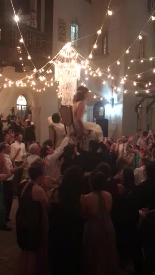Newlyweds hold on to their chairs!
