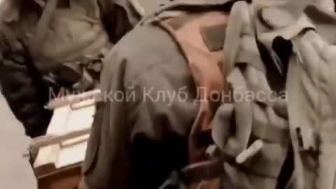 Ukrainian servicemen are evacuated after striking a military unit