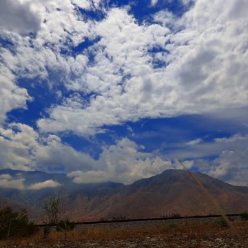 Time Lapse of White Clouds under a Blue Sky
