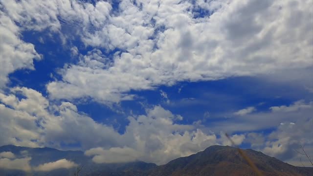 Time Lapse of White Clouds under a Blue Sky