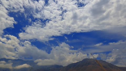 Time Lapse of White Clouds under a Blue Sky