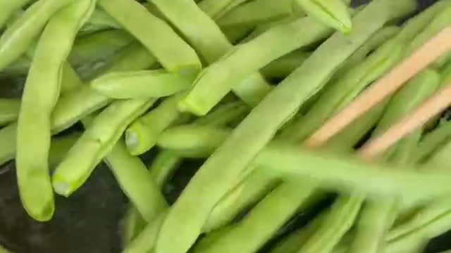 The cook greased the pan before frying the vegetables.