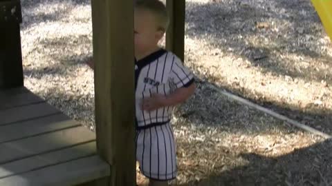 Kid Laughs So Hard At His Dad That He Falls Off Playground Equipment