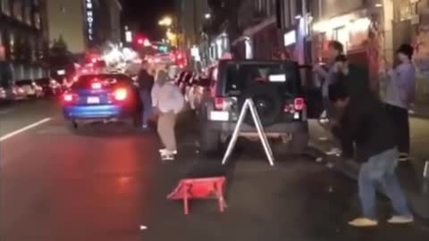 Skateboard teenager on city street at night