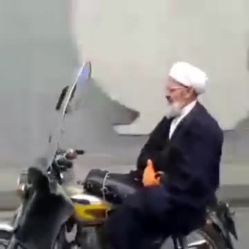 Akhond Rides a Bike without Holding On to the Handlebars