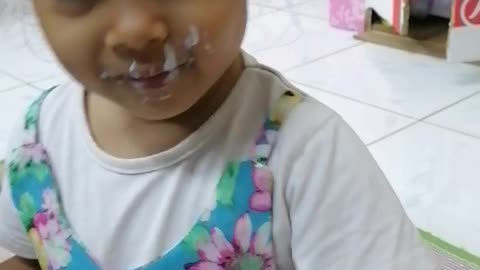 funnny Beby loves eating yogurt