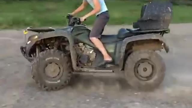 Slowmo. ATV take donuts on the sunset.