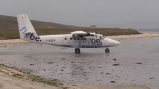 Takeoff under the rain at Barra Airport, Scotland