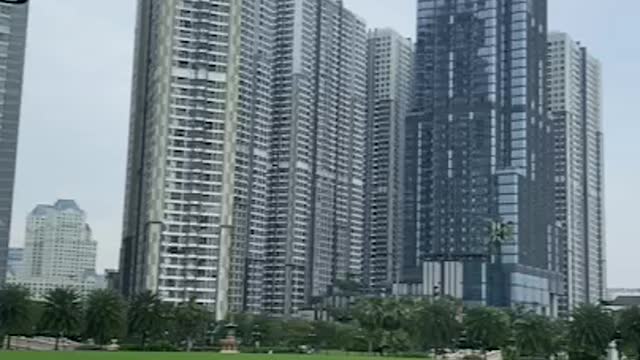 Vast Central Park surrounded by High-rise Apartment