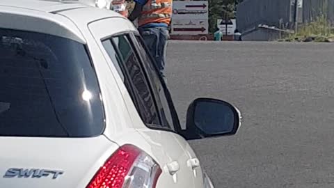 Homeless guy directing traffic in Johannesburg