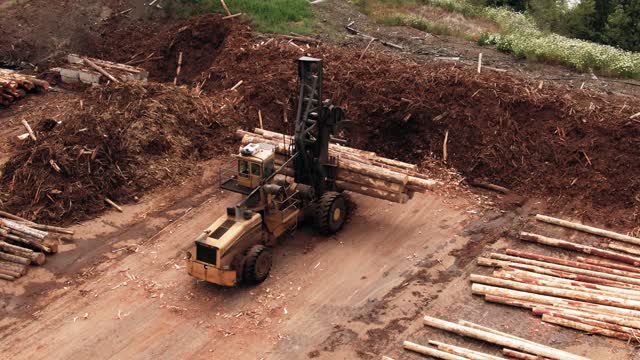 Wood loading video by front loader