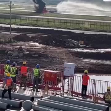 AT THE AIRPORT IN CHONGQING, CHINA, A PLANE WITH 122 PEOPLE ON BOARD ROLLED OUT OF THE RUNWAY AND CAUGHT FIRE